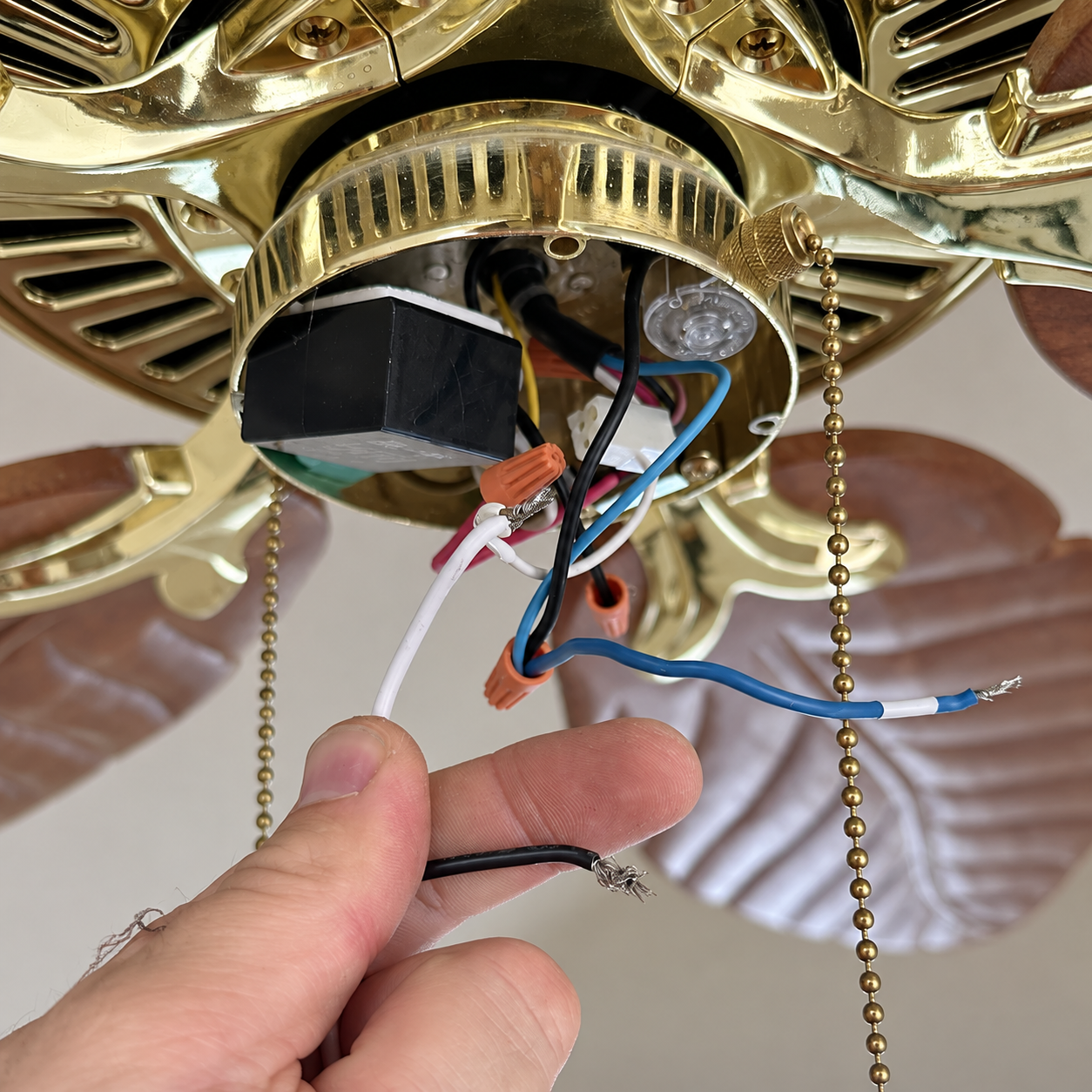 Existing ceiling fan and light fixture wiring inspected during troubleshooting