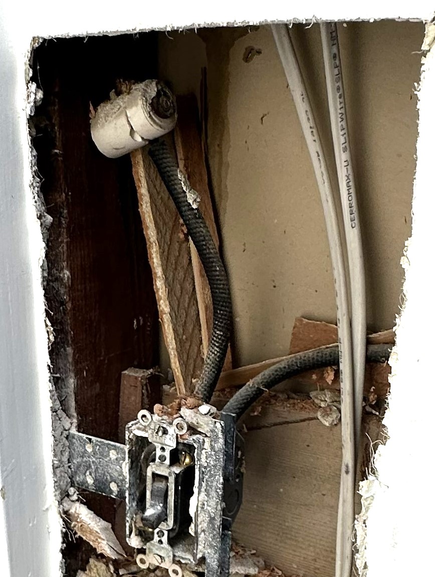 Old electrical switch with knob-and-tube wiring in a San Francisco home