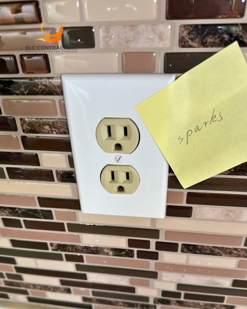 Residential electrical outlet marked for a reported sparking issue in Burlingame, CA