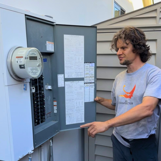 Licensed electrician performing an electrical panel upgrade at a home in the Bay Area